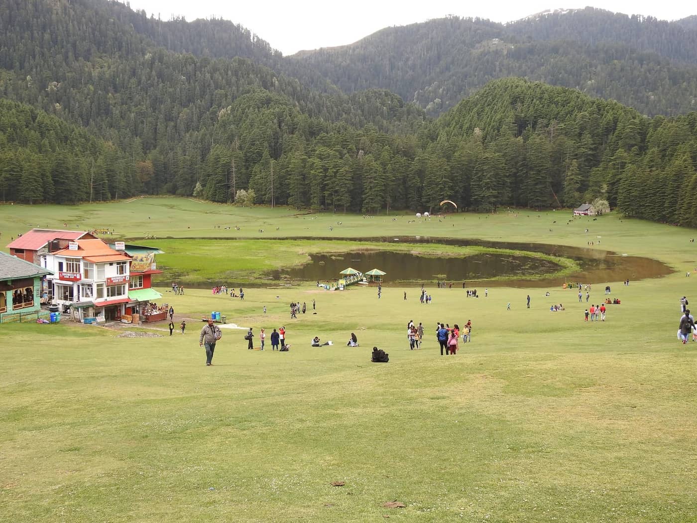 The saucer-shaped meadow and small lake of Khajjiar ringed by deodar forest