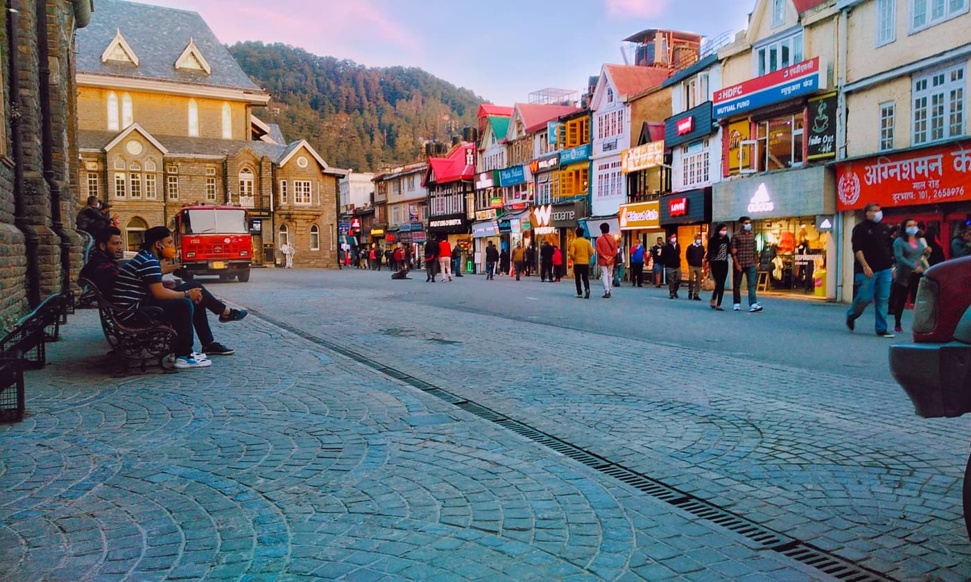 Evening crowds on the cobbled Mall Road in Shimla lined with shops