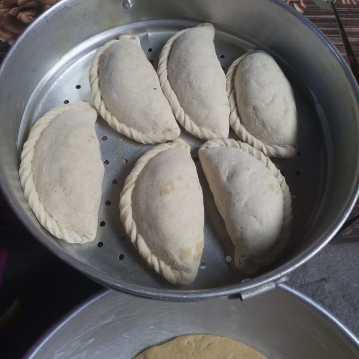 Freshly shaped siddu, the stuffed steamed bread of Himachal Pradesh, in a steamer
