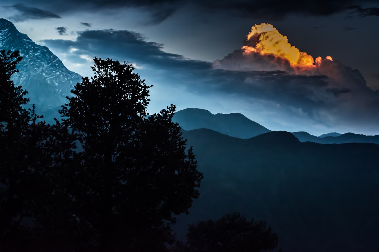 Dusk over the Dhauladhar peaks from Triund, with a lit cloud above the ridge